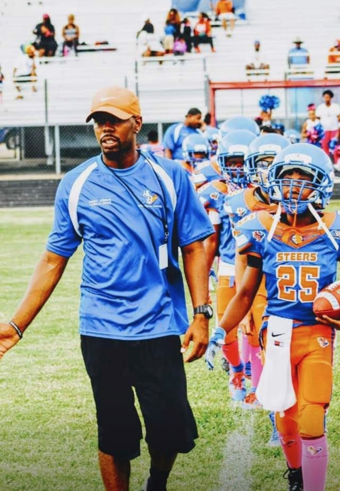 Youth football coach and team